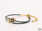 Adjustable double string green bracelet with twin T motifs