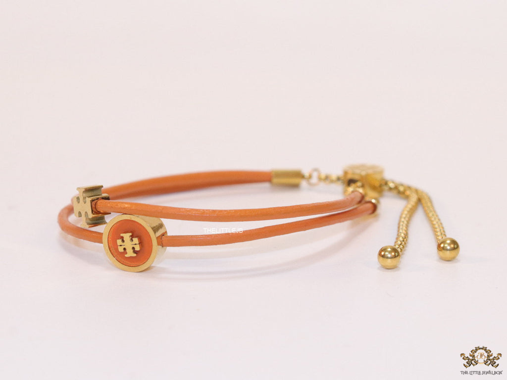 Adjustable double string orange bracelet with twin T motifs