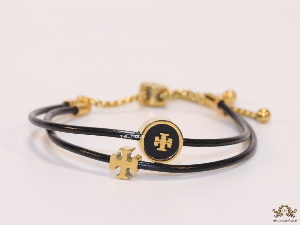 Adjustable double string black bracelet with twin T motifs