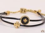 Adjustable double string black bracelet with twin T motifs