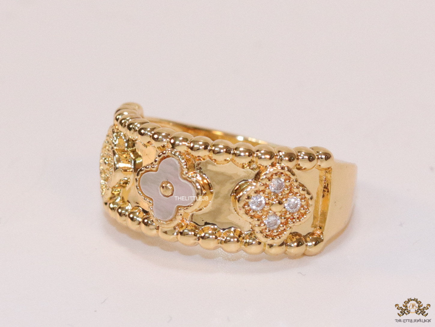 Golden ring band with MOP and cz clovers