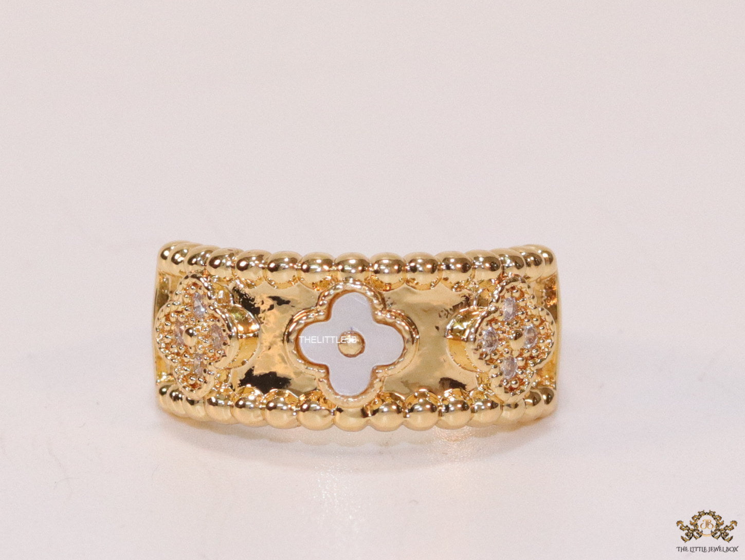 Golden ring band with MOP and cz clovers