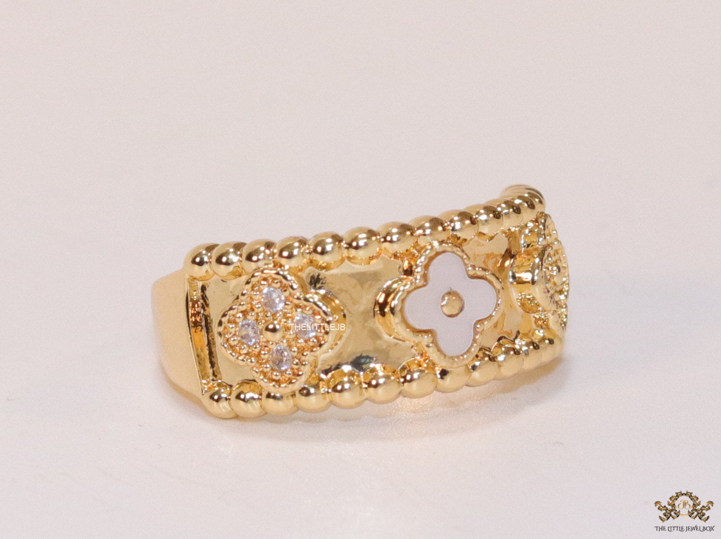 Golden ring band with MOP and cz clovers