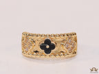 Golden ring band with black enamel and cz clovers