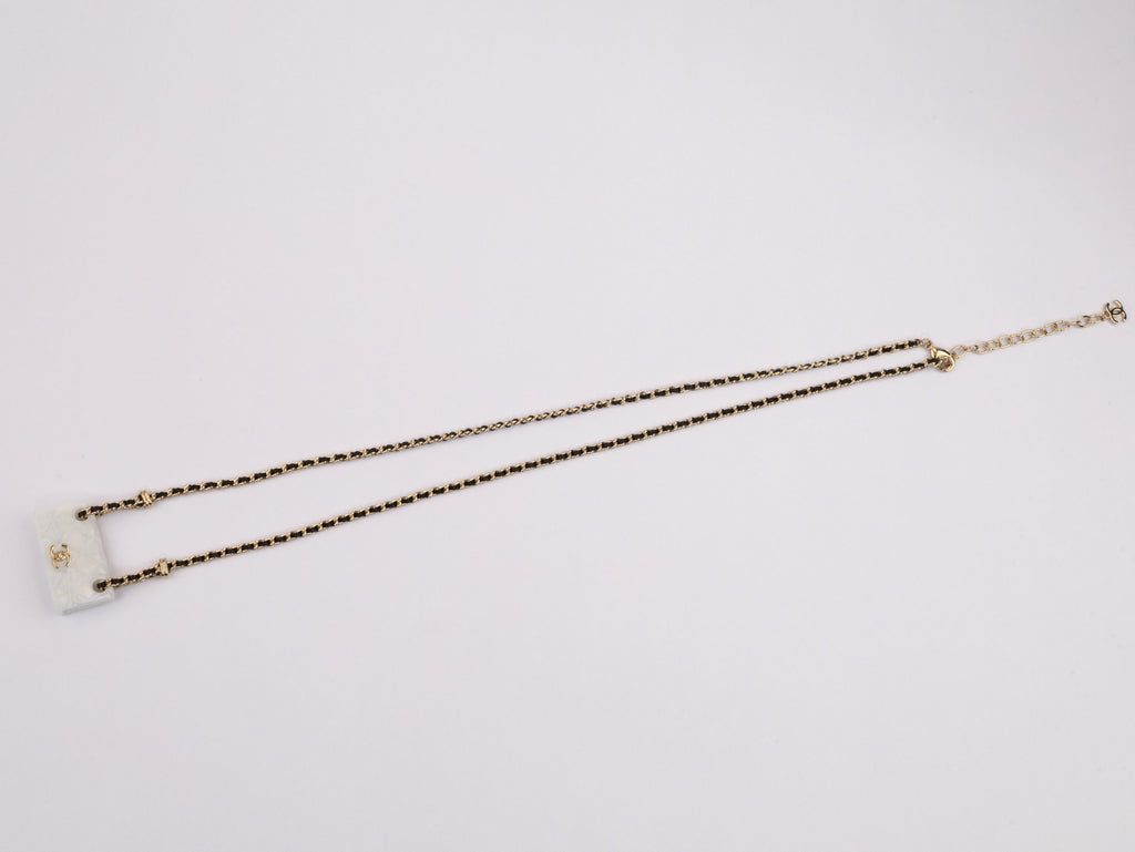 Double C enamel Bag on a black and gold chain