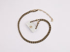 Double C enamel Bag on a black and gold chain