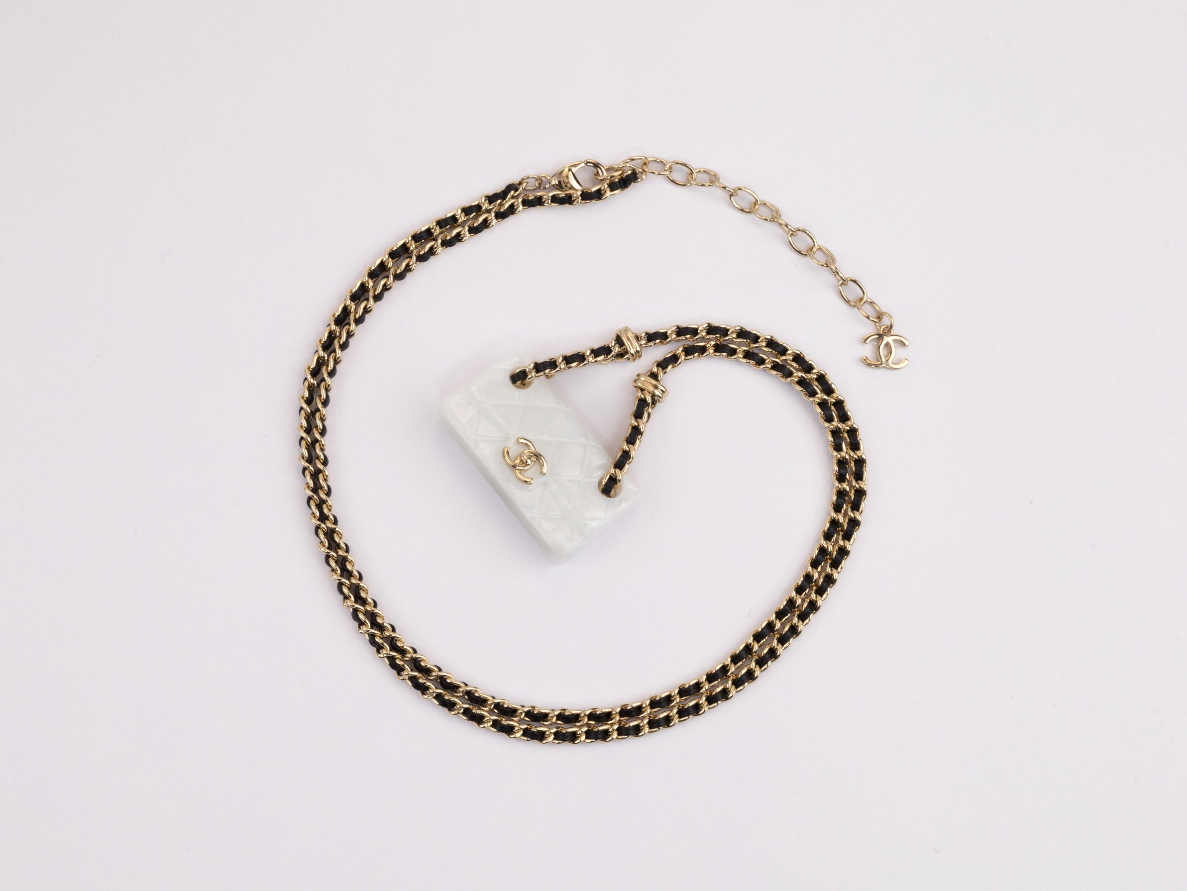 Double C enamel Bag on a black and gold chain