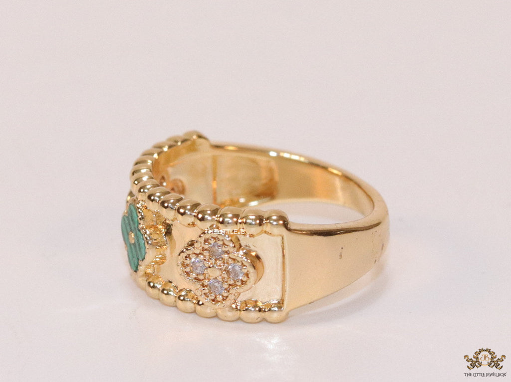 Golden ring band with malachite green and cz clovers