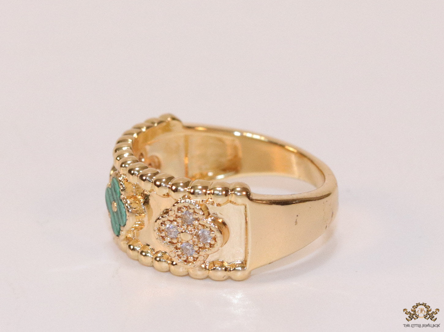 Golden ring band with malachite green and cz clovers