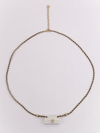 Double C enamel Bag on a black and gold chain