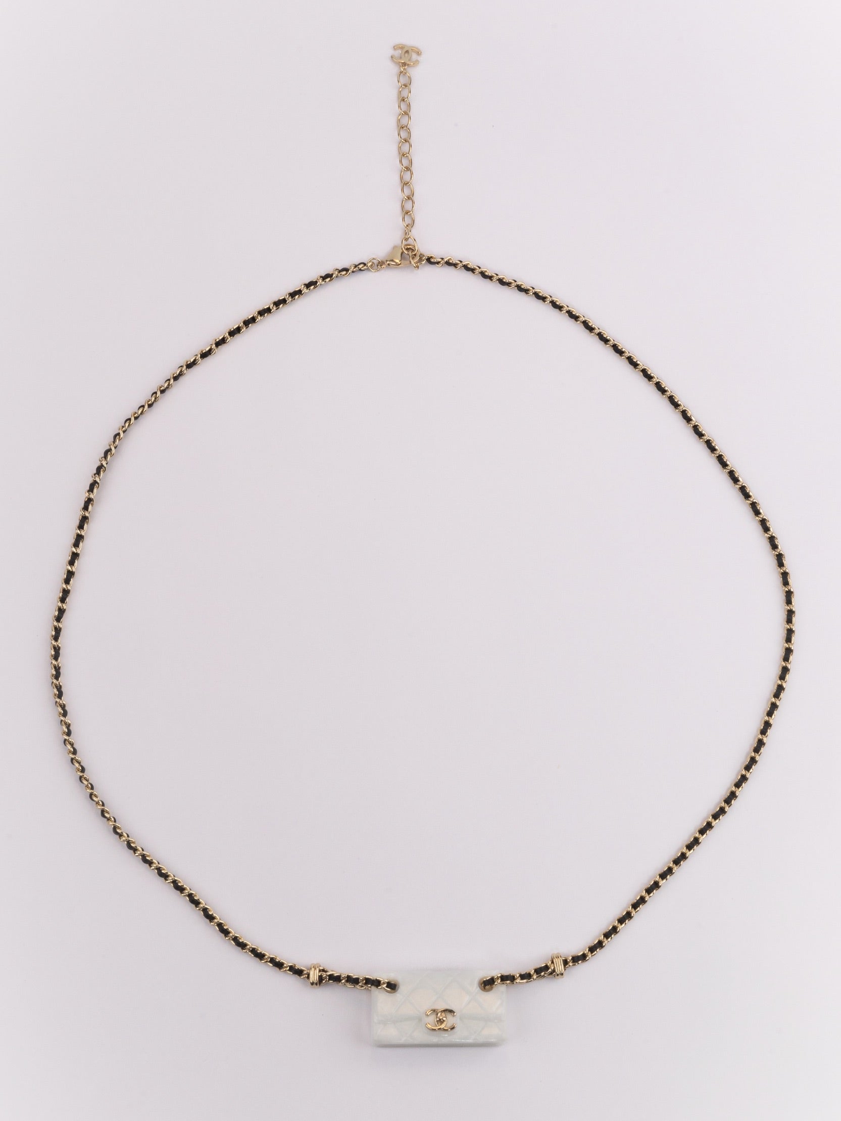Double C enamel Bag on a black and gold chain