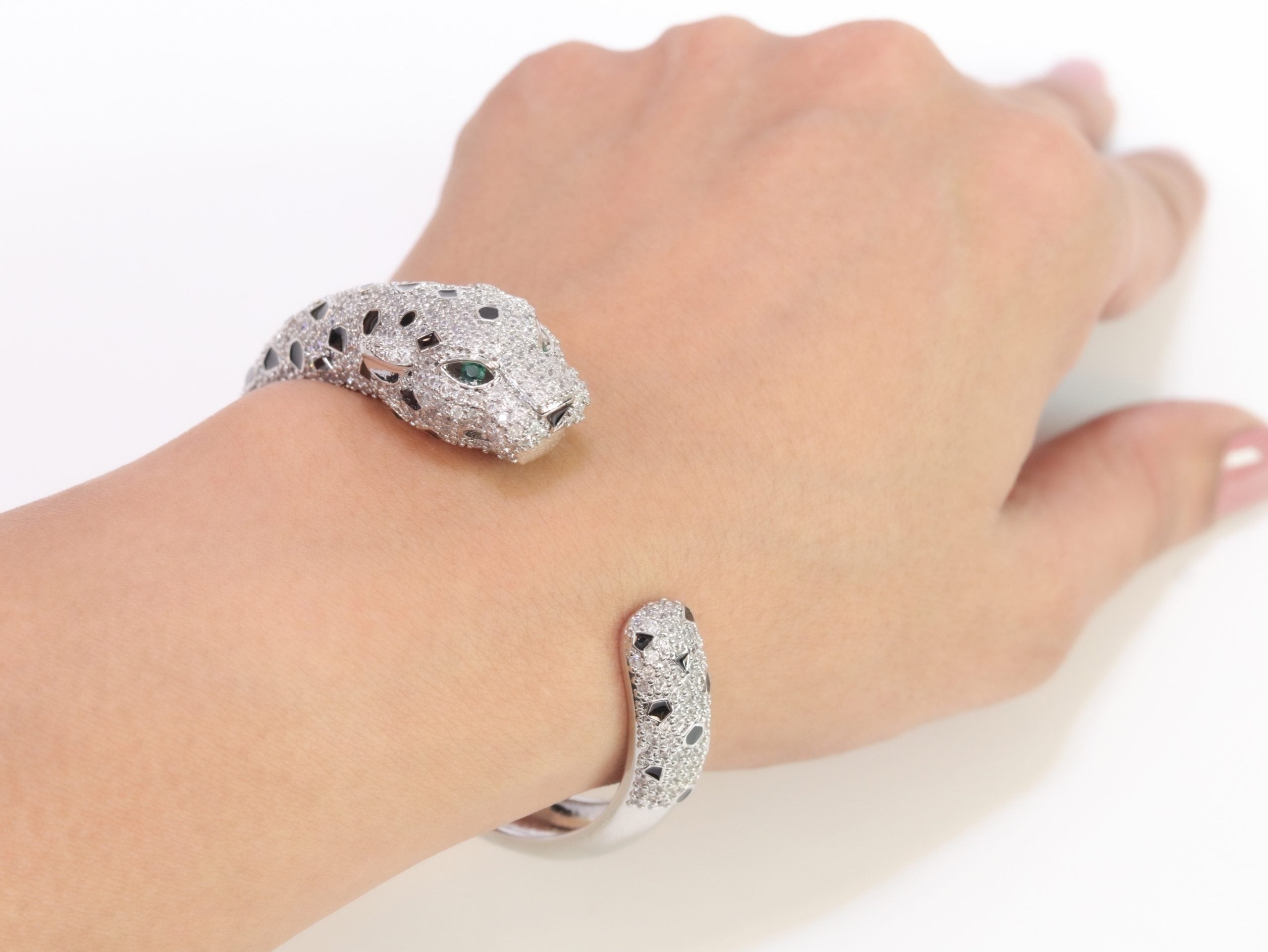 Panther cz platinum bracelet with emerald green stones