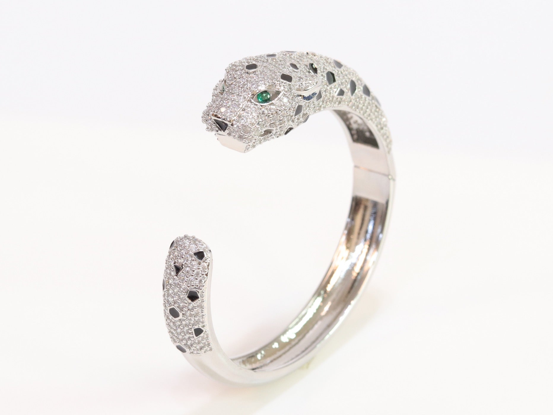 Panther cz platinum bracelet with emerald green stones