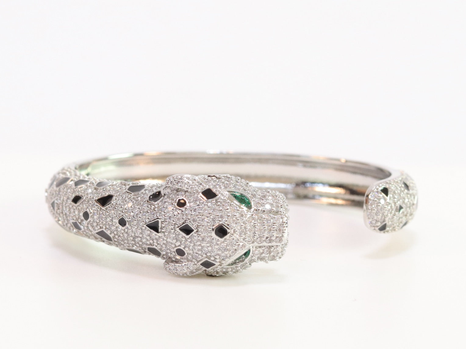 Panther cz platinum bracelet with emerald green stones