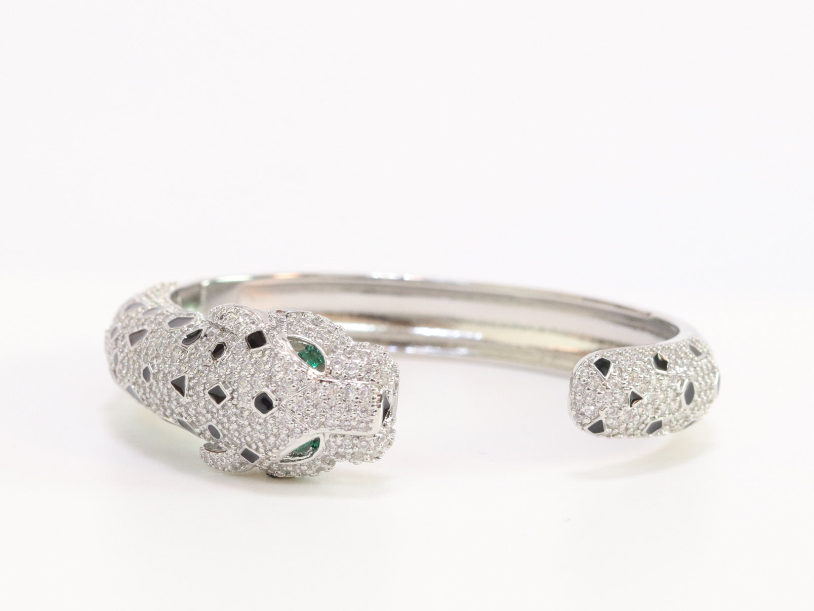 Panther cz platinum bracelet with emerald green stones