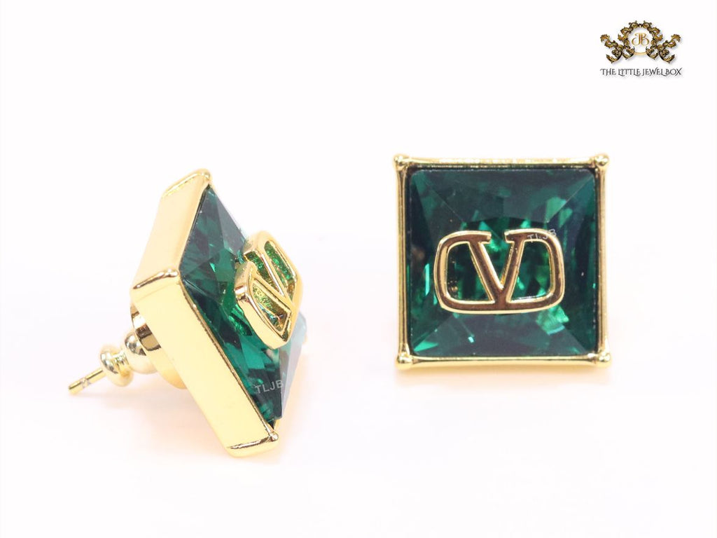 Alphabet V blue and gold studs