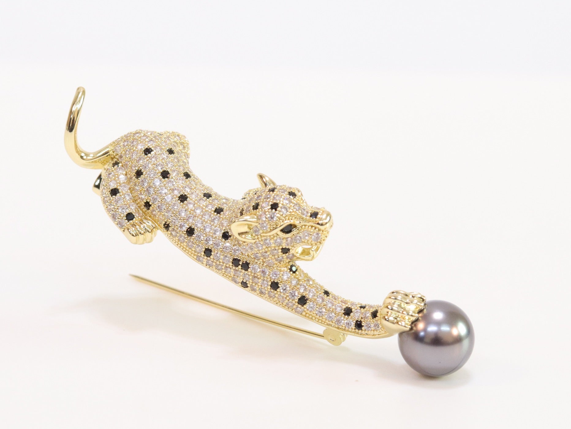 Gold panther with grey pearl and cz brooch
