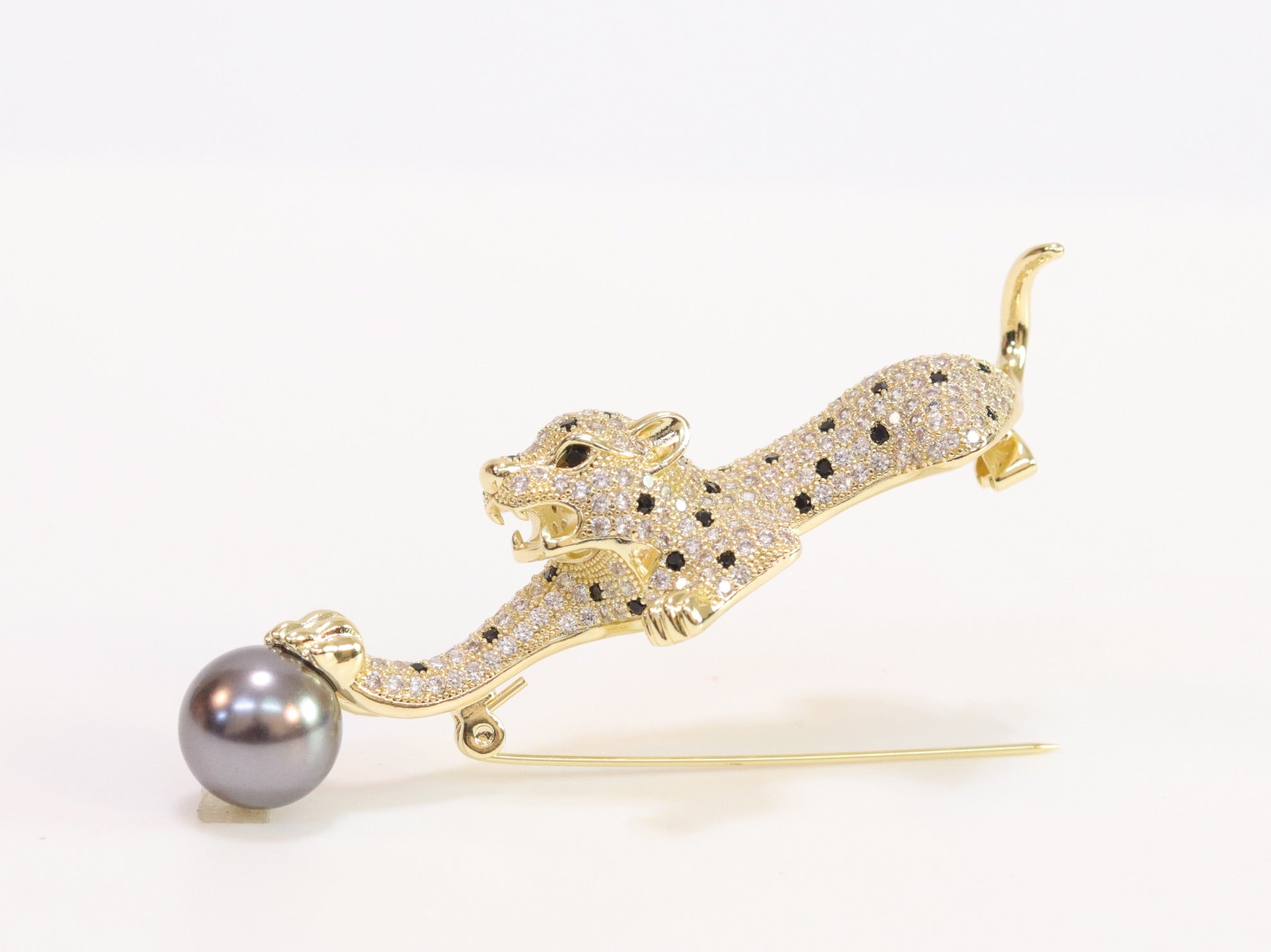 Gold panther with grey pearl and cz brooch