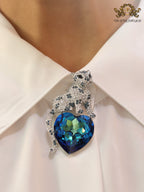 Panther on heart-shaped London blue topaz brooch