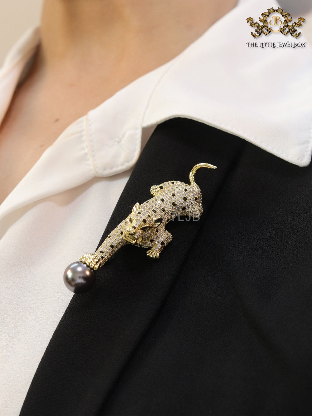 Gold panther with grey pearl and cz brooch