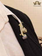 Gold panther with grey pearl and cz brooch
