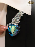 Inverted panther on heart-shaped London blue topaz brooch
