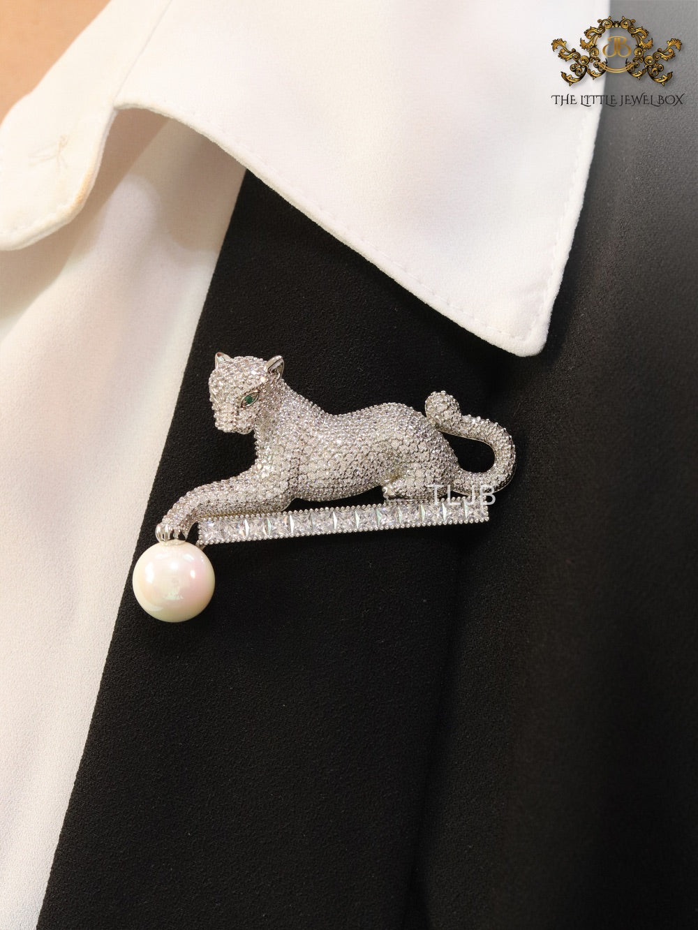 Platinum panther with white pearl, cz and emerald stones brooch