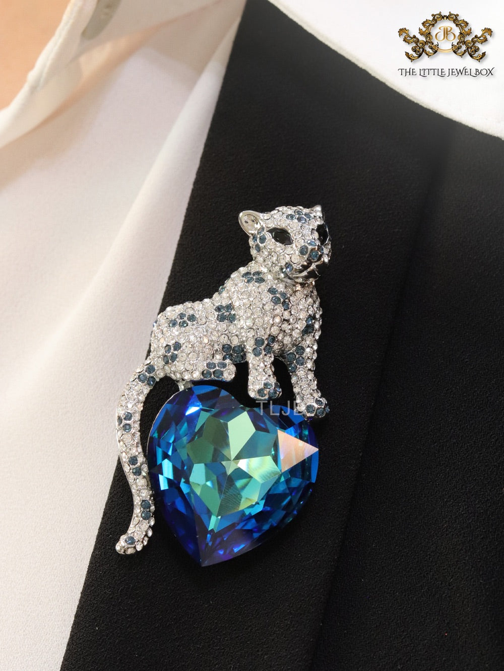 Panther on heart-shaped London blue topaz brooch