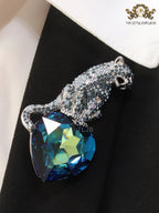 Inverted panther on heart-shaped London blue topaz brooch
