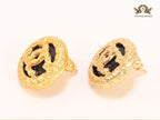 Black and gold double C studs