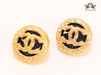 Black and gold double C studs