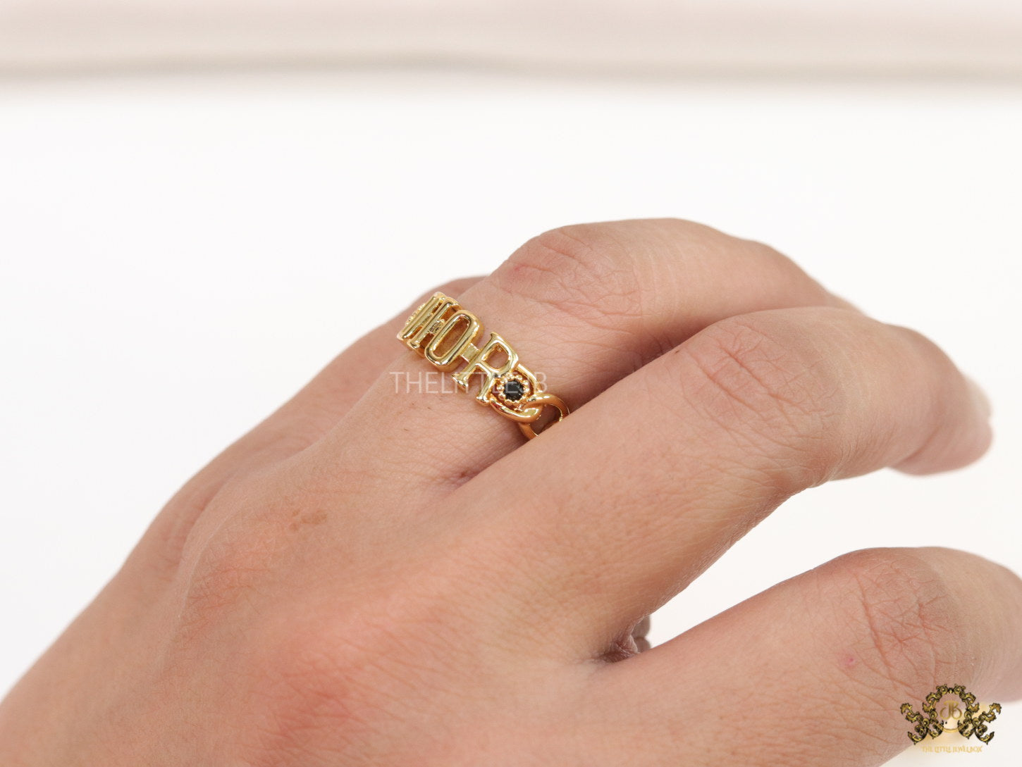 Gold plated alphabet open ring with black cz