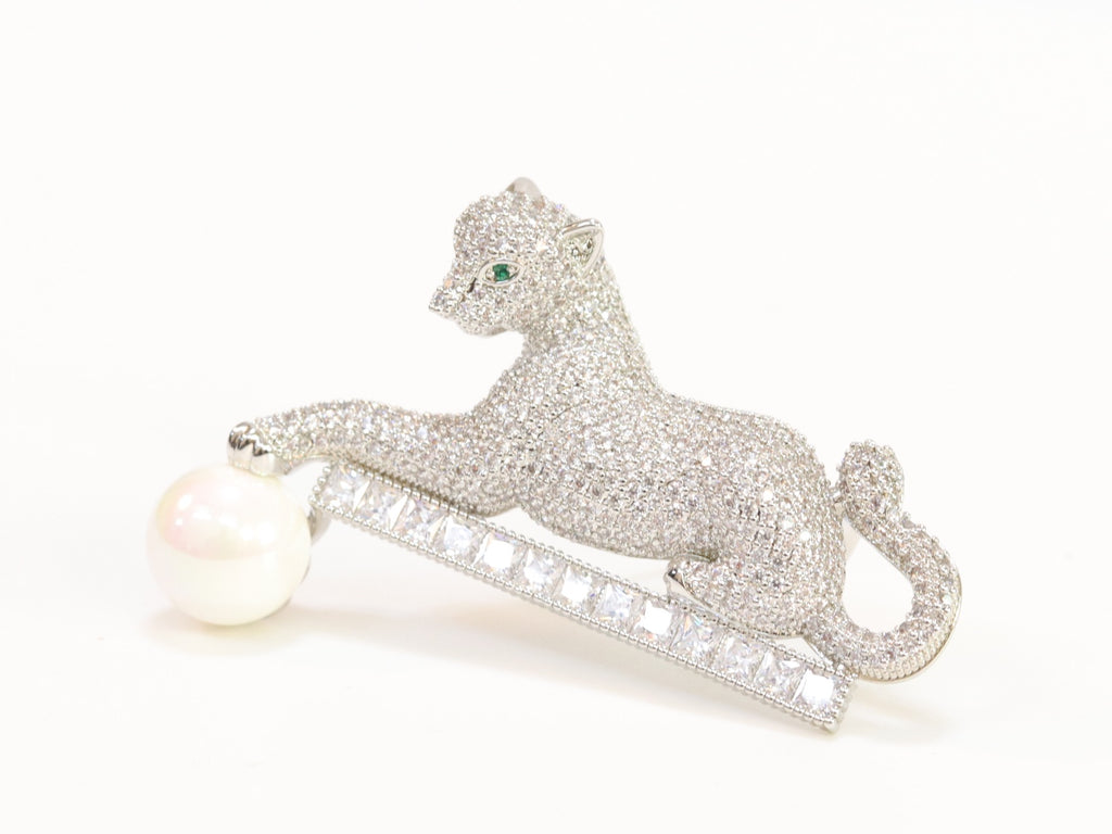 Platinum panther with white pearl, cz and emerald stones brooch