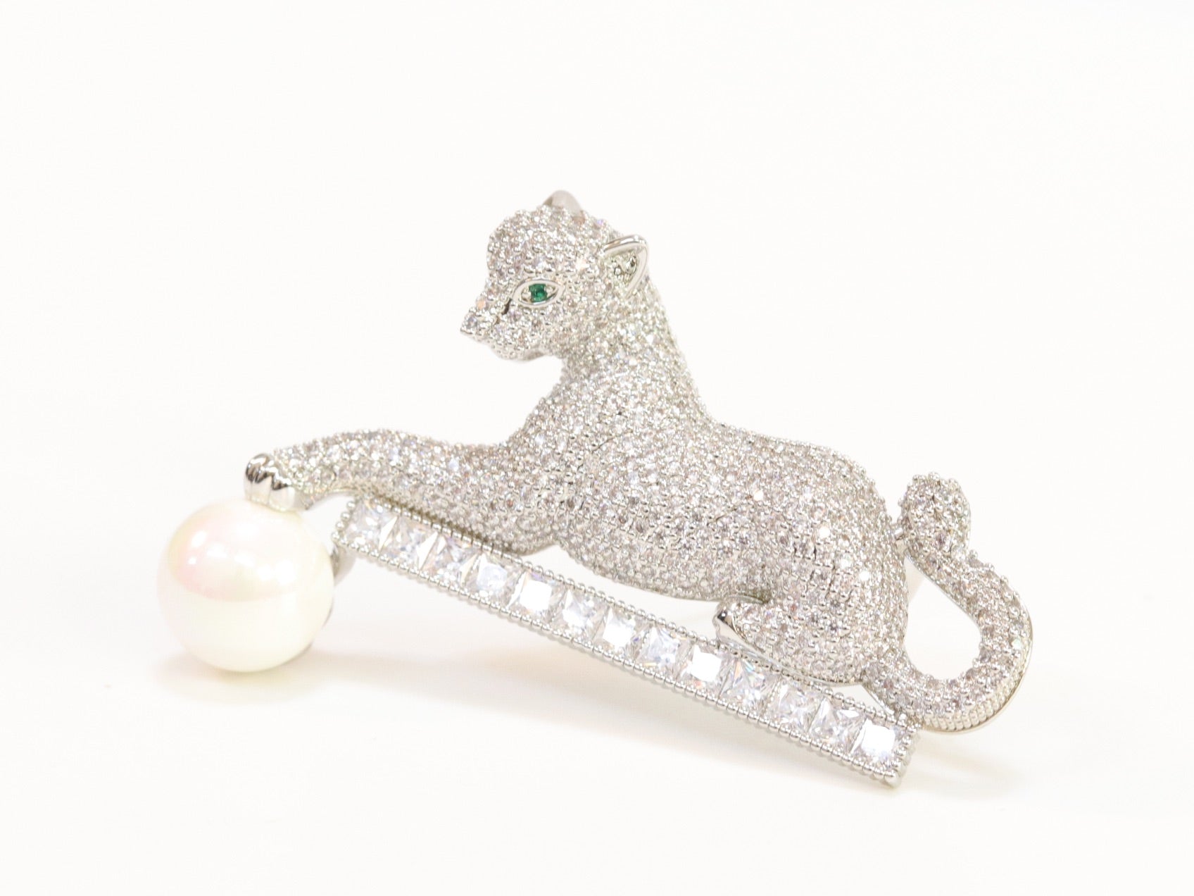 Platinum panther with white pearl, cz and emerald stones brooch