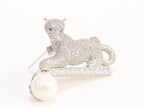 Platinum panther with white pearl, cz and emerald stones brooch