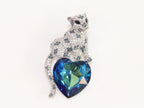 Panther on heart-shaped London blue topaz brooch