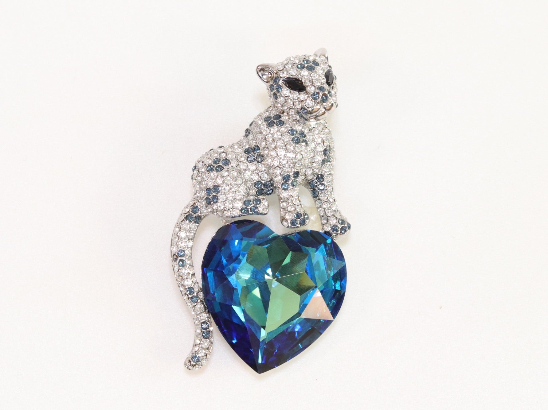 Panther on heart-shaped London blue topaz brooch