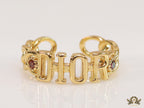Gold plated alphabet open ring with orange cz