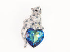 Panther on heart-shaped London blue topaz brooch