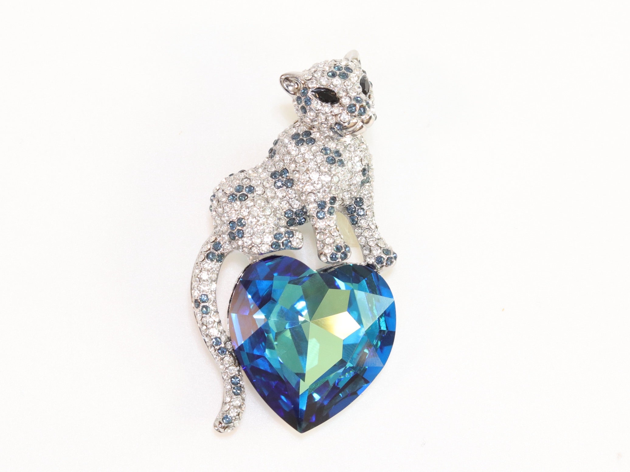 Panther on heart-shaped London blue topaz brooch