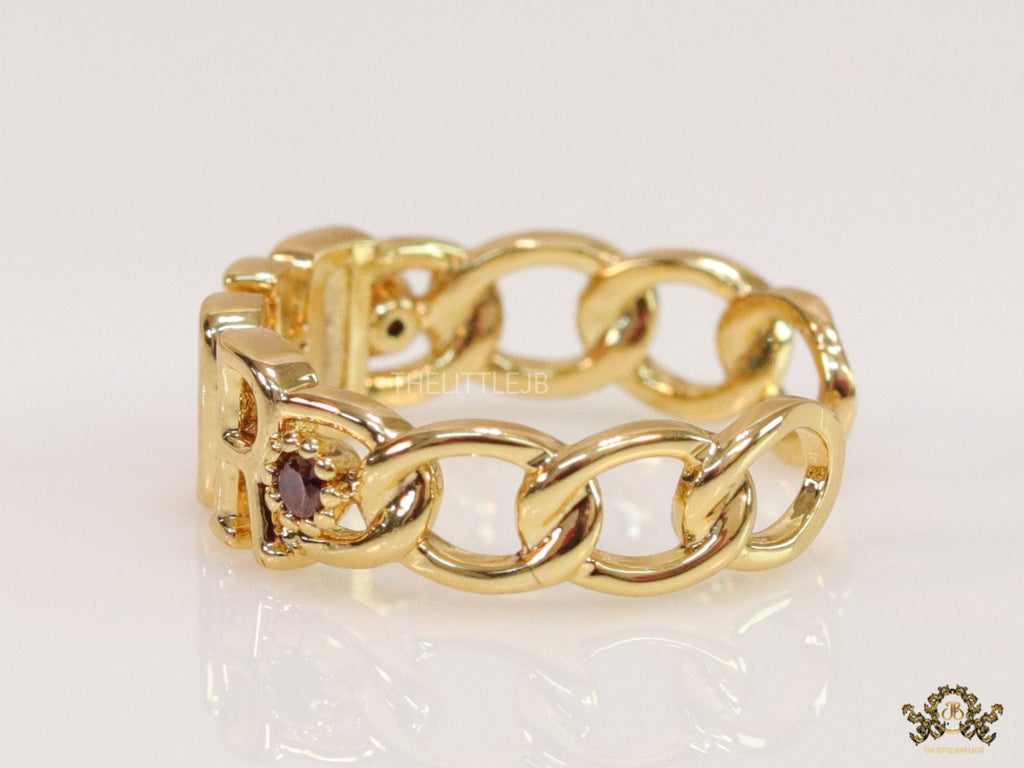Gold plated alphabet open ring with orange cz