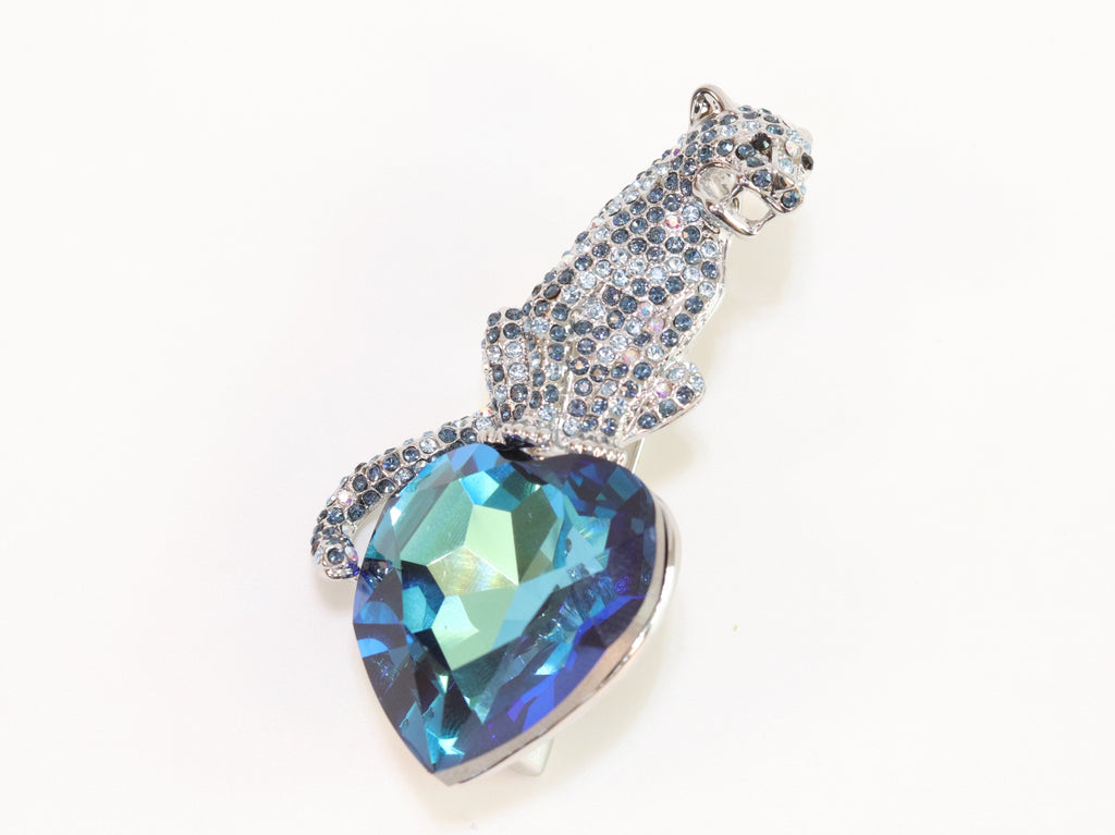 Inverted panther on heart-shaped London blue topaz brooch