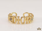 Gold plated alphabet open ring with white cz