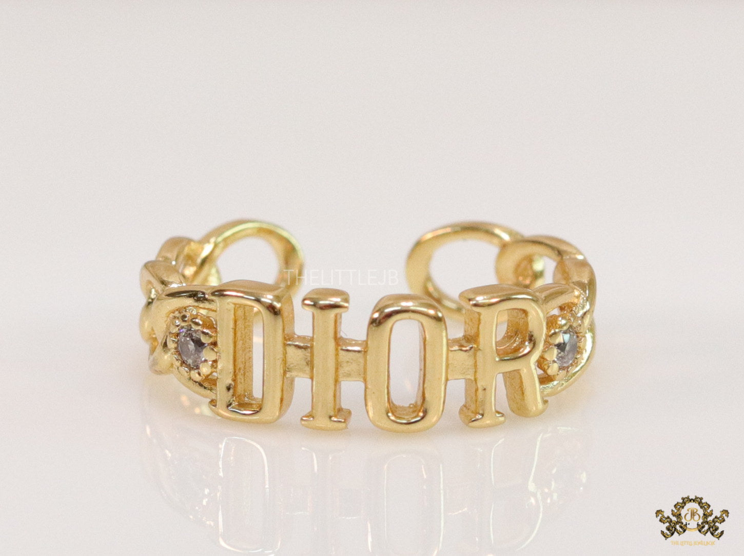Gold plated alphabet open ring with white cz
