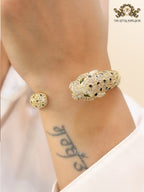 Panther cz gold bracelet with emerald green stones