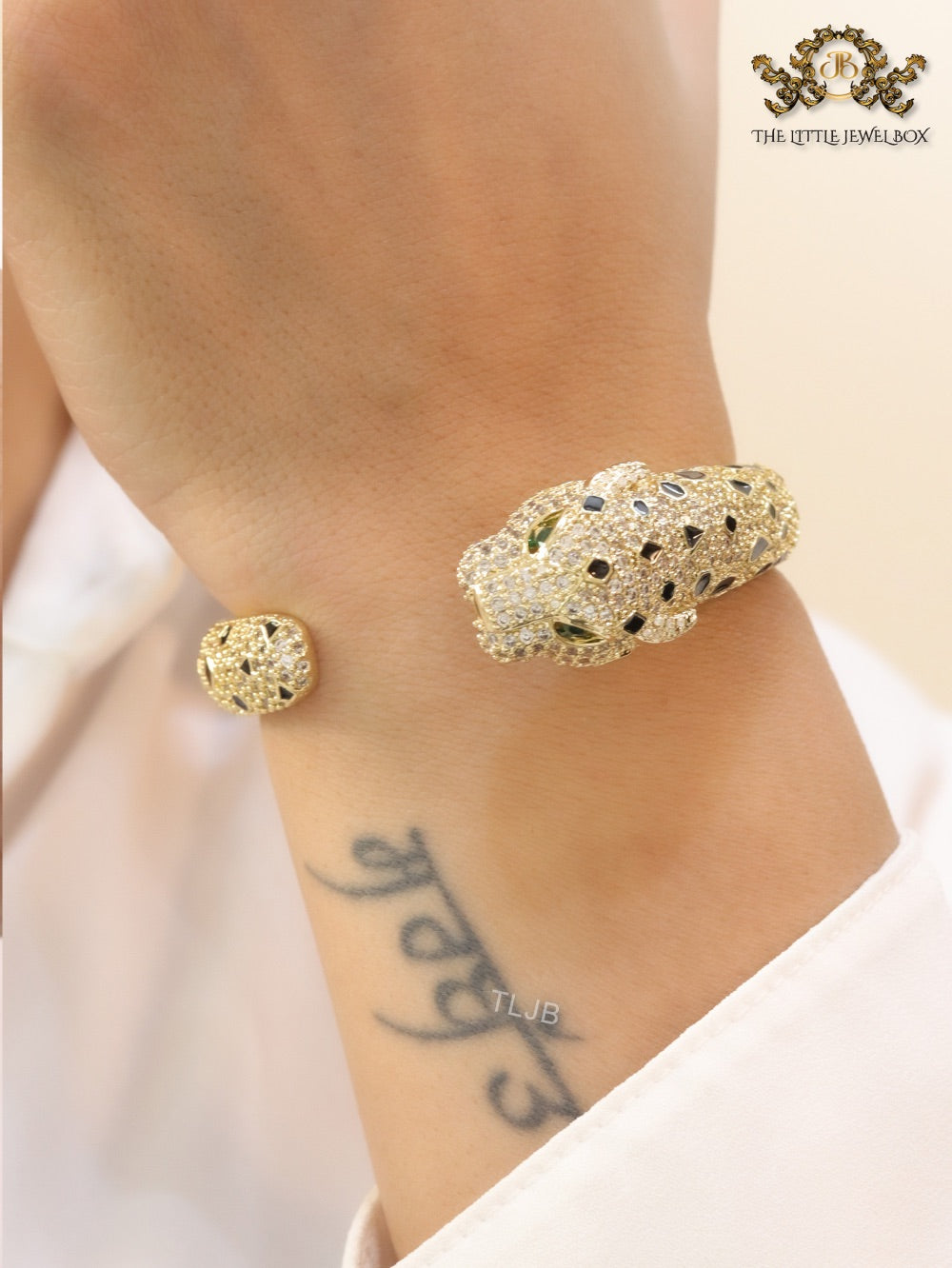 Panther cz gold bracelet with emerald green stones