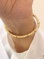 Medusa gold plated open bracelet