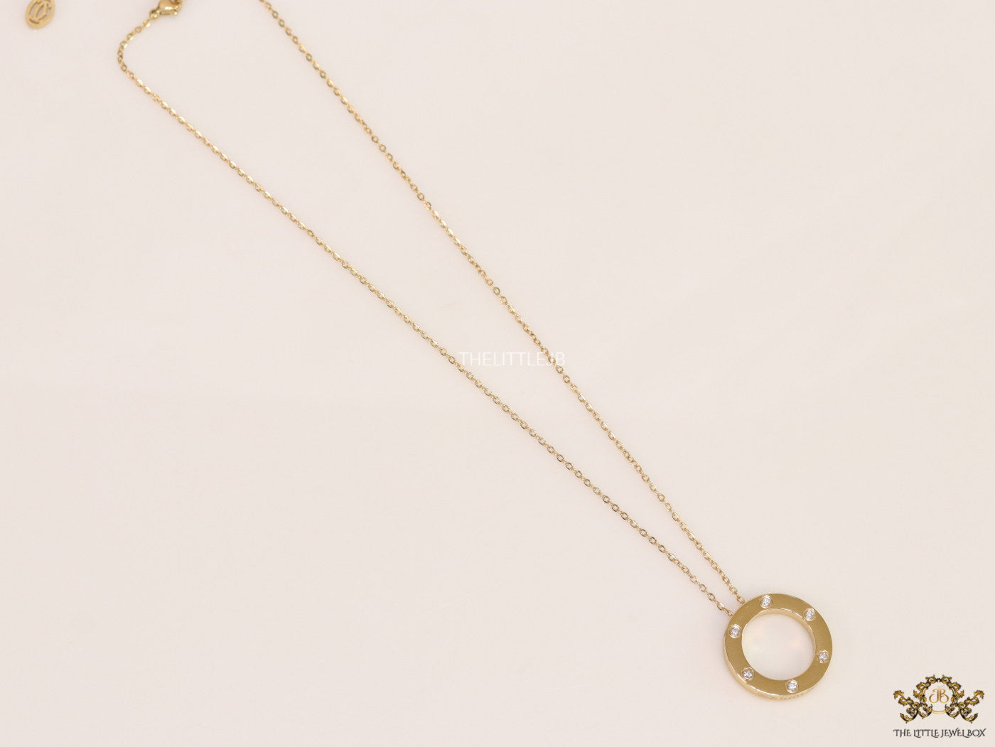 Gold plated disc shape pendant necklace with cz