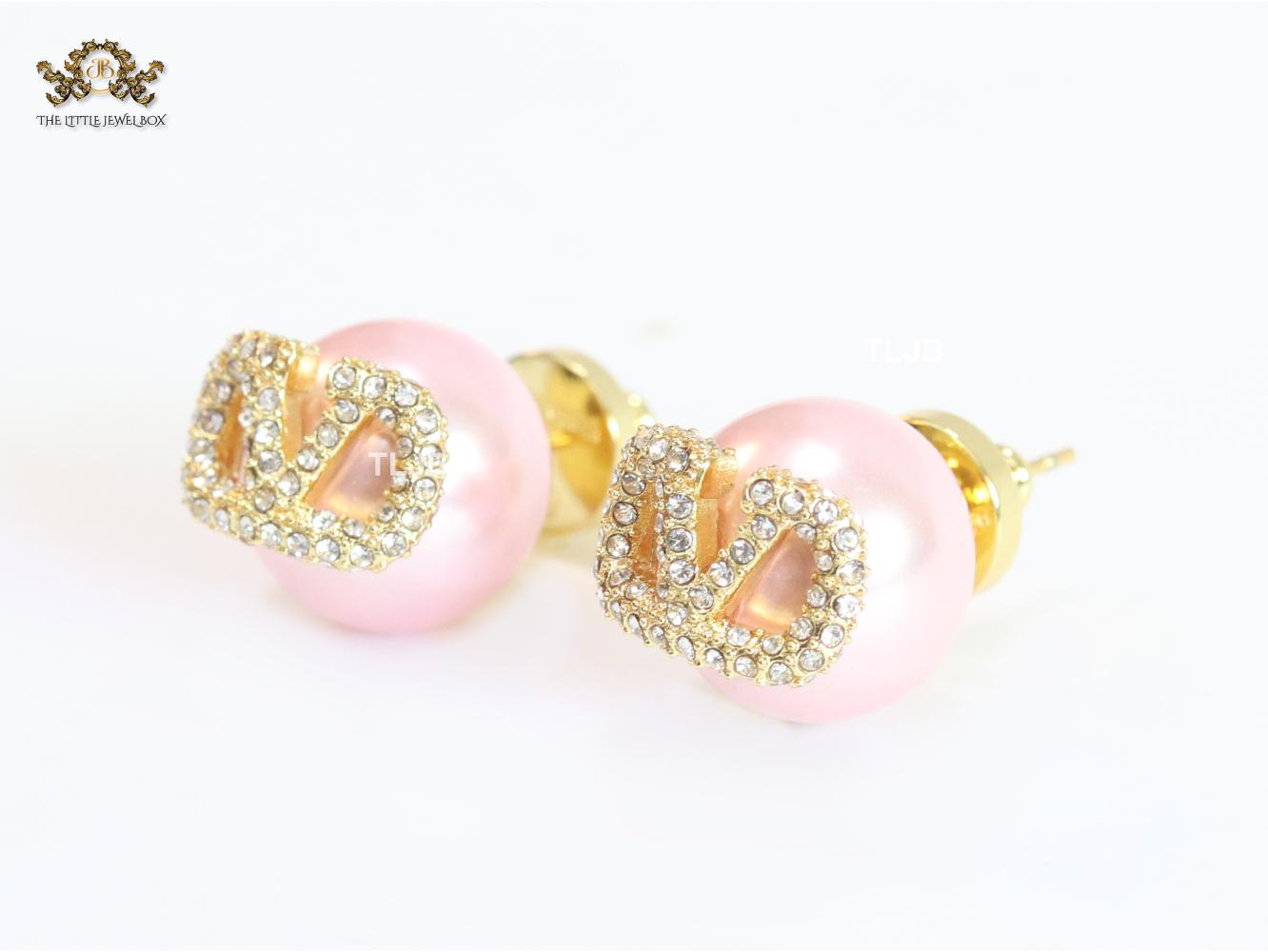 Pink pearl open studs