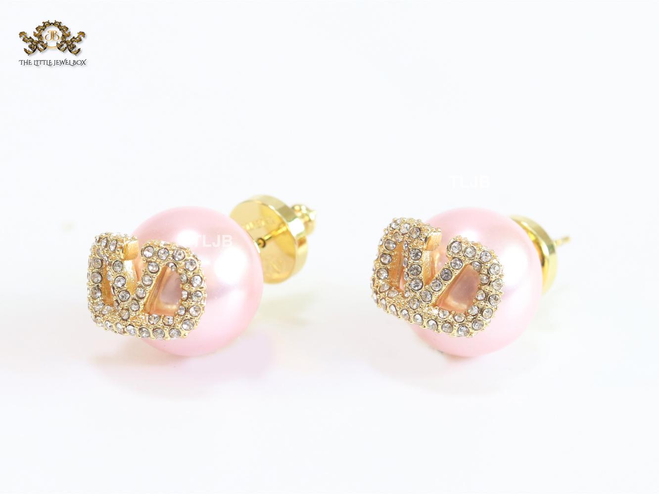 Pink pearl open studs